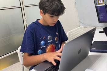 An Encode Education student mastering universal computational logic in a Hong Kong classroom.
