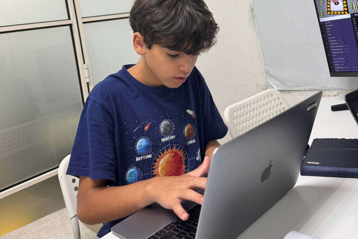 An Encode Education student mastering universal computational logic in a Hong Kong classroom.
